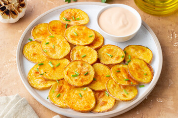Baked potatoes with sauce. Homemade chips. Appetizer. Snack. Vegetarian food.