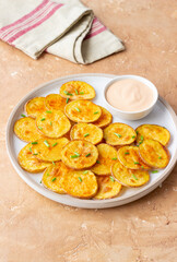 Baked potatoes with sauce. Homemade chips. Appetizer. Snack. Vegetarian food.