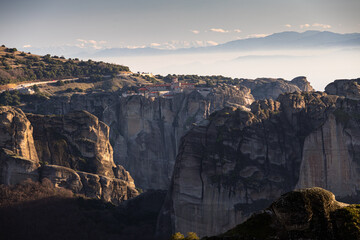 Sunset over Meteora. Amazing landscape of Monastery of the Holy Trinity from Meteora, iconic place for Greek people and orthodox around the world.