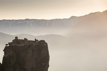 Sunset over Meteora. Amazing landscape of Monastery of the Holy Trinity from Meteora, iconic place for Greek people and orthodox around the world.