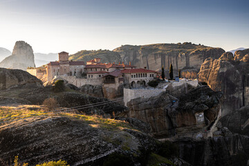 Sunset over Meteora. Amazing landscape of Monastery of the Holy Trinity from Meteora, iconic place for Greek people and orthodox around the world.