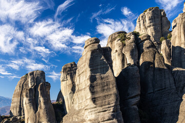 The mountains of Meteora. Amazing landscape with the cliffs and rocks from Meteora during a day with blue wky and spectacular clouds. Travel to Greece.