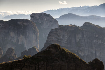 The mountains of Meteora. Amazing landscape with the cliffs and rocks from Meteora during a day with blue wky and spectacular clouds. Travel to Greece.