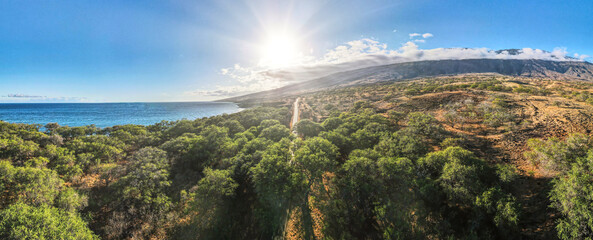 A road trip along the Maui South Piilani Highway during golden sunset hour