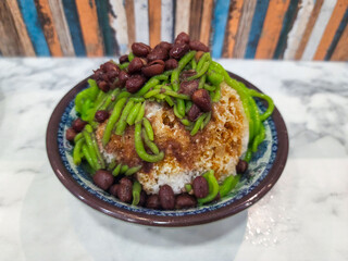 Cendol is a Malaysian dessert made of shaved ice, coconut milk, green pandan jelly noodles, and sweet dark brown sugar syrup. 