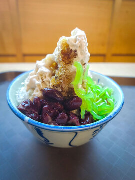 Cendol is a Malaysian dessert made of shaved ice, coconut milk, green pandan jelly noodles, and sweet dark brown sugar syrup. 