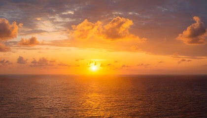 Fototapeta premium sunset over the ocean, Sunset sky clouds over sea in the evening with Orange, Yellow sunlight Golden hour in Summer landscape,
