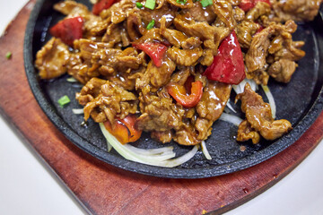 Chinese meat dish in a Chinese restaurant close-up