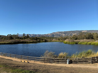 Tranquil Lake Carneros in Goleta with Santa Ynez mountains in the back on a warm southern Caliornia winter day