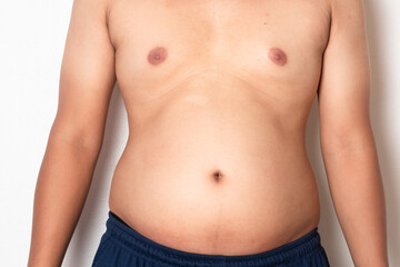 Overweight or obese man on white background. Fat mens body measurements. he is dieting and losing weight. Men at risk for diabetes Belly fat. Healthcare, medicine concept