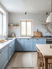 Modern kitchen design with light blue cabinetry and wooden accents