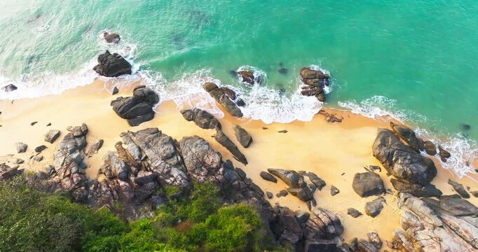 Aerial view top view of sandy beach in the golden morning sun light