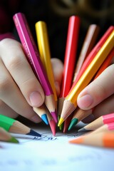 Naklejka premium Close-up of a child drawing with pencils. Selective focus