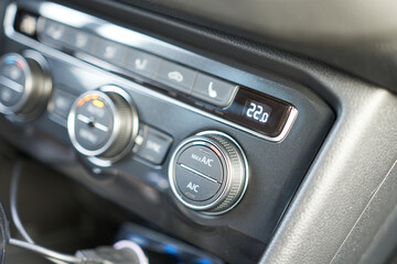 Closeup of the air conditioning and control panel in a modern car