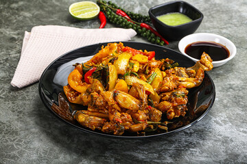 Vietnamese cuisine - fried frog with vegetables