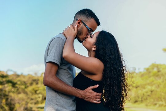 Young couple kissing in park