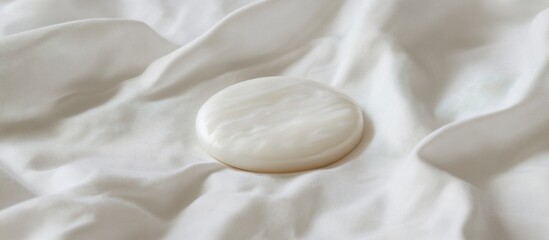 Serene White Disc on Soft Fabric