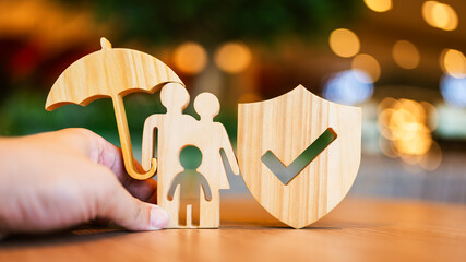 Shield protect icon and family model with umbrella, Security protection and health insurance. The...