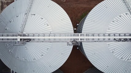 Giant steel grain silos. Grain storage and processing industry in the food industry.