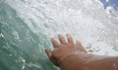 Touching the waves with your hands in the sea, Generative AI
