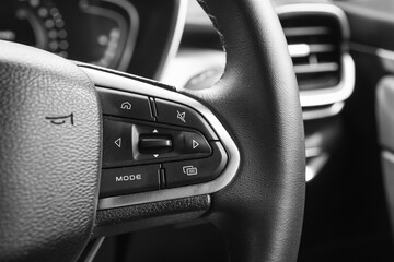 Close-up of Car wheel steering entertainment controller