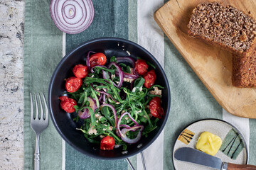 salad and rye bread on breakfast table