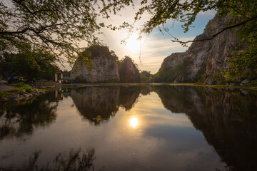 Fototapeta premium Khao Ngu Stone Park is located at Mueang District, Ratchaburi, Used to be an important blasting and crushing site in Thailand, a small limestone from the Permian period of the Ratchaburi Rock Group
