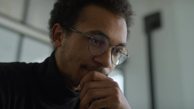 Pensive young man deep in thought