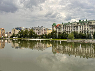Fototapeta premium Houses in the center of Kazan reflected in the water of the Black Lake, Russia