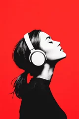 Woman with headphones and bold red background © JFM