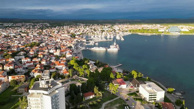 Drone flying forward, parallel to a small croatian city.