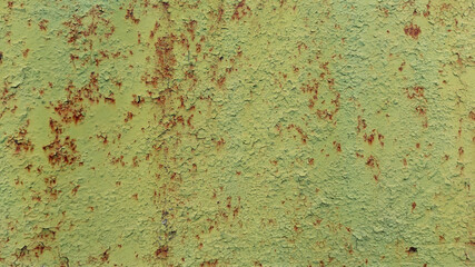 Weathered Green Painted Metal Showing Cracks and Corrosion