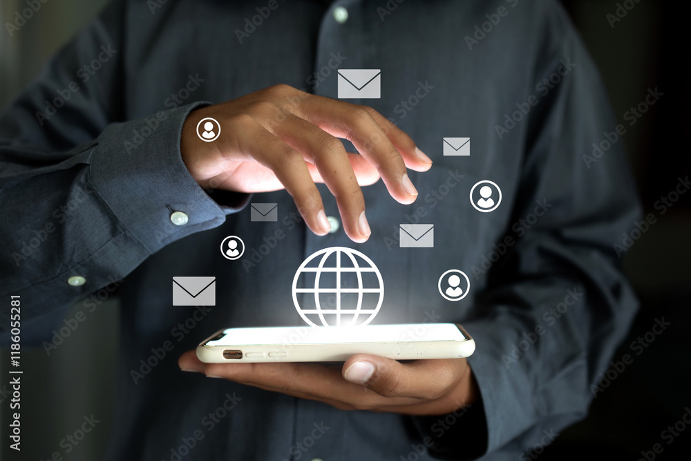 Poster a man is holding a mobile phone and tapping a globe on the screen. there are many emails on the scre