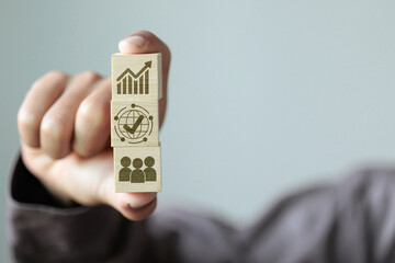 Stacked blocks representing growth, global success, and teamwork