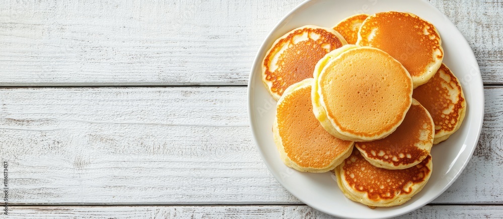 Leinwandbilder Delicious corn pancakes arranged on a white wooden table viewed from above Area for text. with copy space image. Place for adding text or design