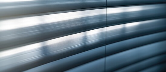 Sunlight streams onto fabric blinds designed as a corrugated sheet with horizontal gray stripes. with copy space image. Place for adding text or design