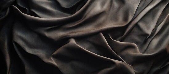 Fototapeta premium Abstract design wrinkles on the fabric Textile plain dark backdrop. with copy space image. Place for adding text or design