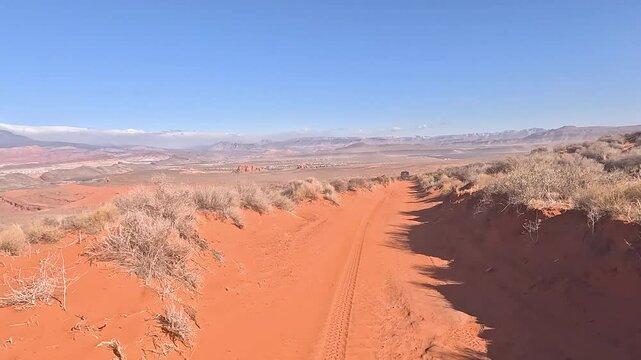 Off road desert sandy trail 4x4 POV Utah 2. Off road trail riding in 4x4 all terrain vehicle for sport and recreation. Desert landscape, dusty trails and recreation areas. Southwest Utah