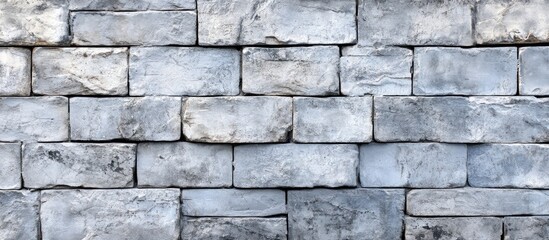 Fototapeta premium Old grunge gray stone brick wall texture serves as an abstract background Copyspace for a horizontal architectural backdrop wallpaper