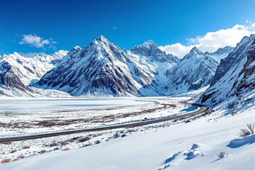 Snow-covered mountains with a winding road, crisp blue sky, and a white landscape. Serene winter scenery, natural and breathtaking concept. Ai generative