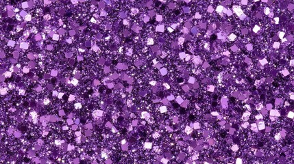 A close-up of purple glitter sparkling under studio lights, creating a festive and luxurious vibe.