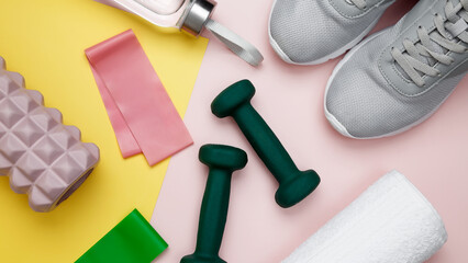 Athletes equipment set dumbbells, resistance band, foam roller for Myofascial release, healthy lifestyle