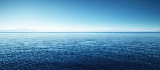 Obraz premium Seascape featuring a sea horizon and nearly clear deep blue sky Background. with copy space image. Place for adding text or design