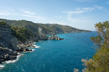 View of the sea, mountains, rocks, beaches, islands and the sky from different sides of the Skopelos island Greece.