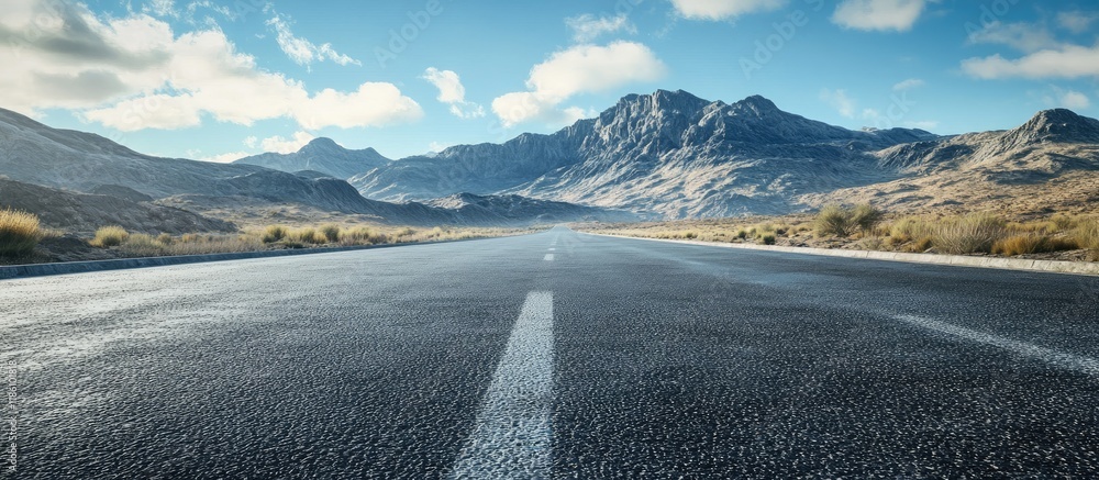 Leinwandbilder mountain scenery set against an asphalt road. with copy space image. place for adding text or design
