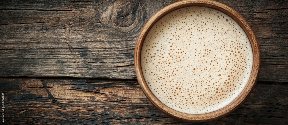 Poster dry yeast in a bowl on a wooden surface. with copy space image. place for adding text or design