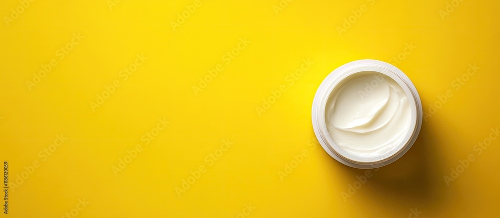 Poster cosmetic cream for skin on a yellow background top view with copy space