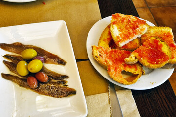 Delicious Mediterranean Appetizer with Olives and Tomato Bruschetta for Gourmet Dining