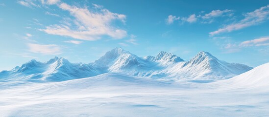 Obraz premium Snowy mountains and snow covered fields against a blue sky. with copy space image. Place for adding text or design