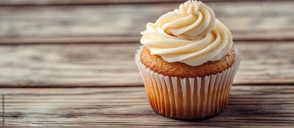 Fototapete Homemade vanilla cupcakes on a wooden surface Breakfast. with copy space image. Place for adding text or design